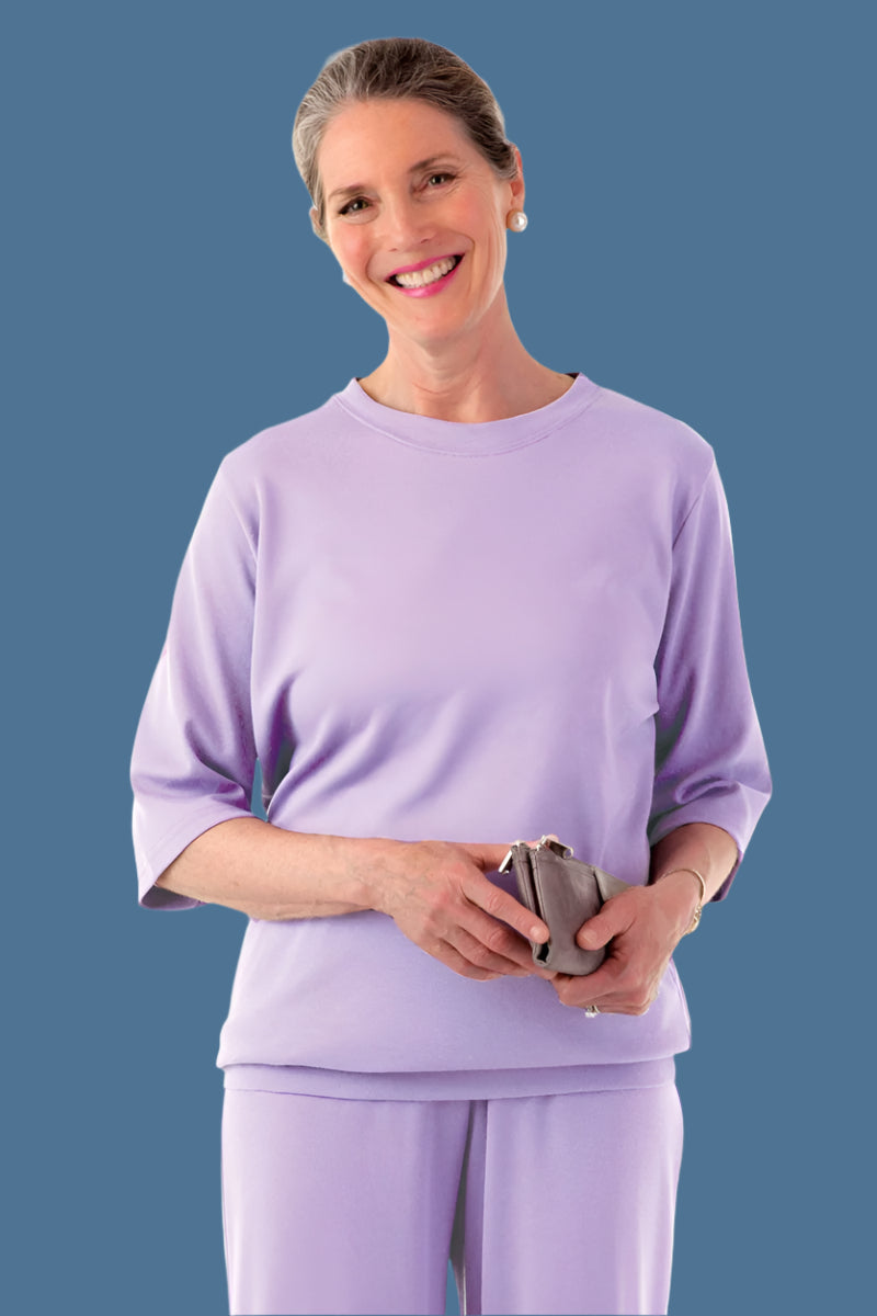 Women's 3/4 Sleeve Banded Bottom Top by Buck & Buck in Lilac, and available in different sizes. This tops item is part of our blouses collection.
