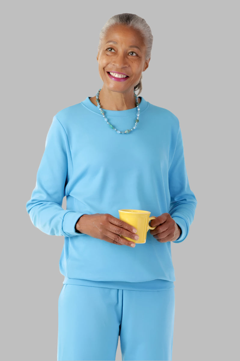 Women's Long Sleeve Banded Bottom Top by Buck & Buck in Blue, and available in different sizes. This tops item is part of our blouses collection.