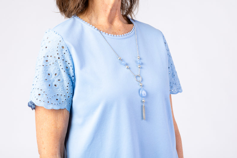 The Women's Short Sleeve Eyelet Top by Alfred Dunner in blue and available in different sizes. This top is part of our women's blouses collection.