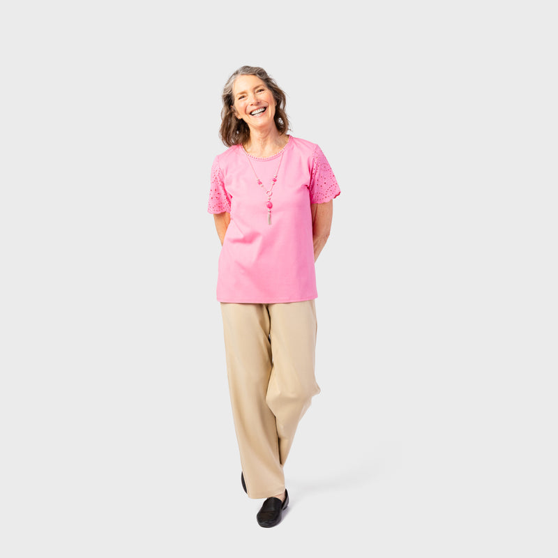 The Women's Short Sleeve Eyelet Top by Alfred Dunner in pink and available in different sizes. This top is part of our women's blouses collection.