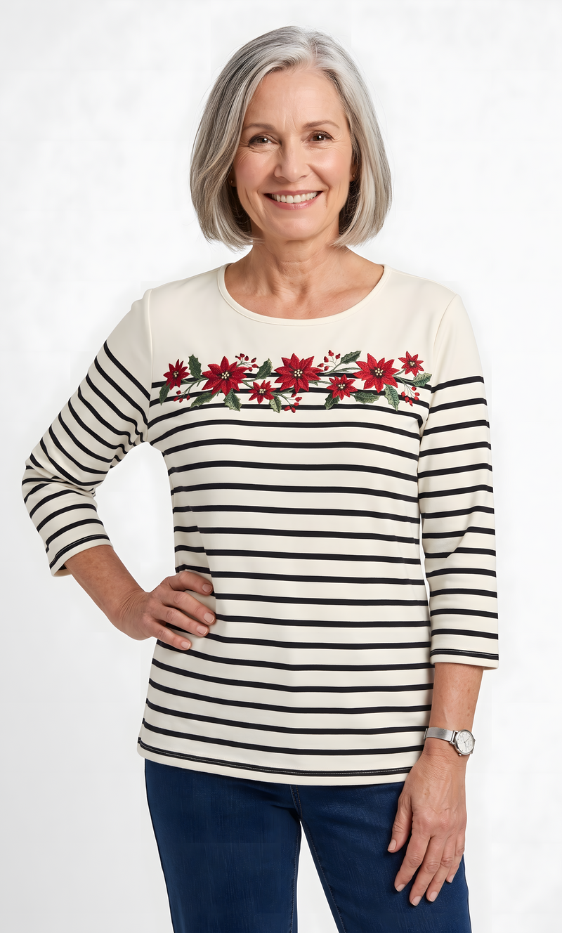 The women's everyday knit top by Alfred Dunner in Christmas Poinsetta and available in different sizes. This top is part of our women's blouses collection.