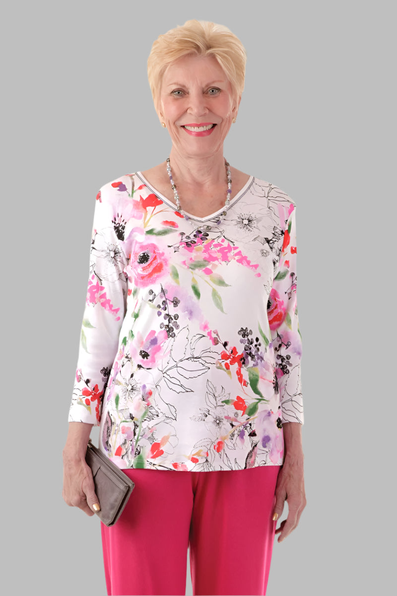 Snap Back Block Printed Knit Top for women by Buck & Buck in Red, and available in different sizes. This tops item is part of our blouses collection.