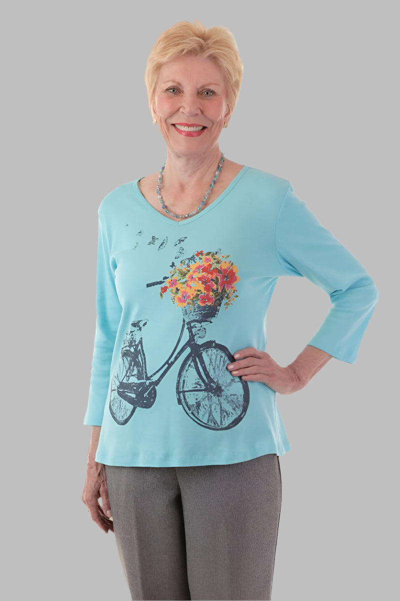 Snap Back Block Printed Knit Top for women by Buck & Buck in Turquoise, and available in different sizes. This tops item is part of our blouses collection.
