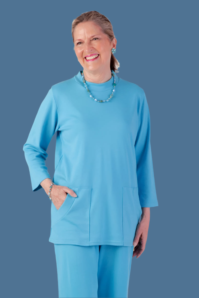 Solid Knit Top With Pockets for women by Buck & Buck in Turquoise, and available in different sizes. This tops item is part of our blouses collection.