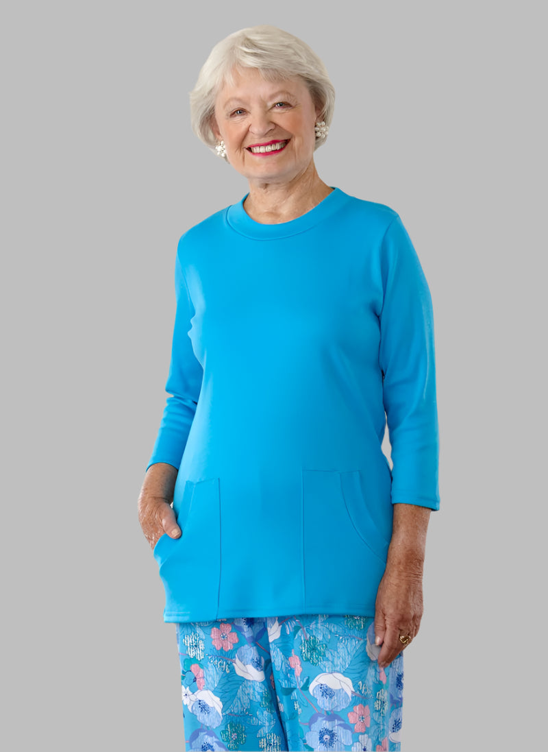 Solid Knit Top With Pockets for women by Buck & Buck in Medium Blue, and available in different sizes. This tops item is part of our blouses collection.