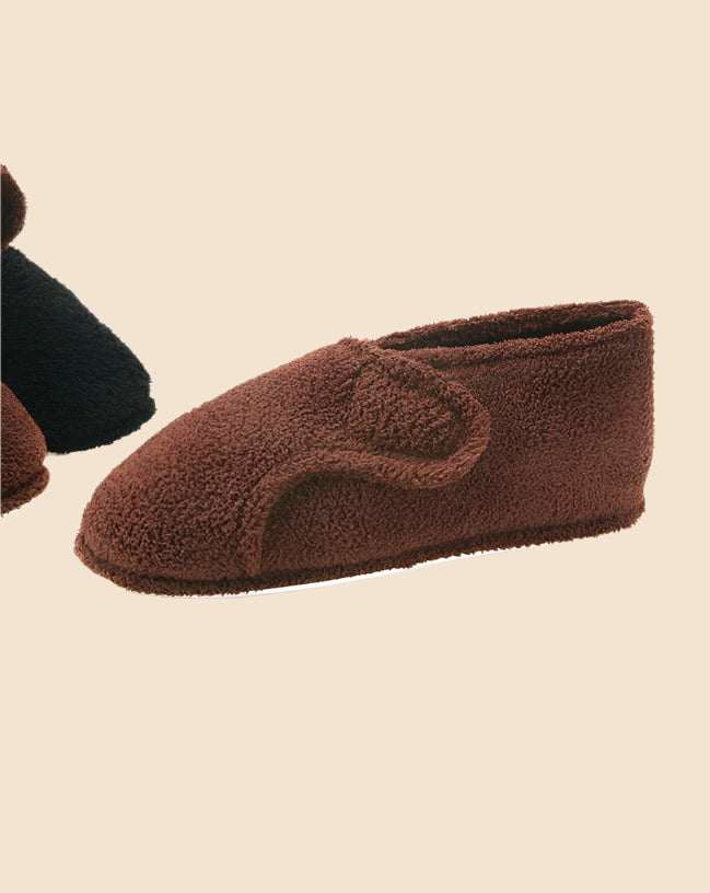 Men's Terry Adjustable Slippers by Buck & Buck in Black, and available only in a one-size option. This footwear item is part of our slippers collection.