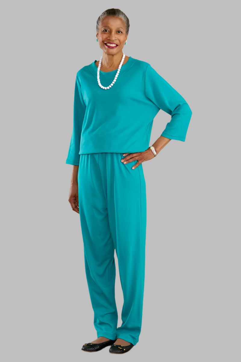 Women's Basic Perfect-Fit Jumpsuit by Buck & Buck in Turquoise, and available in different sizes. This one-piece garments item is part of our one-pieces collection.