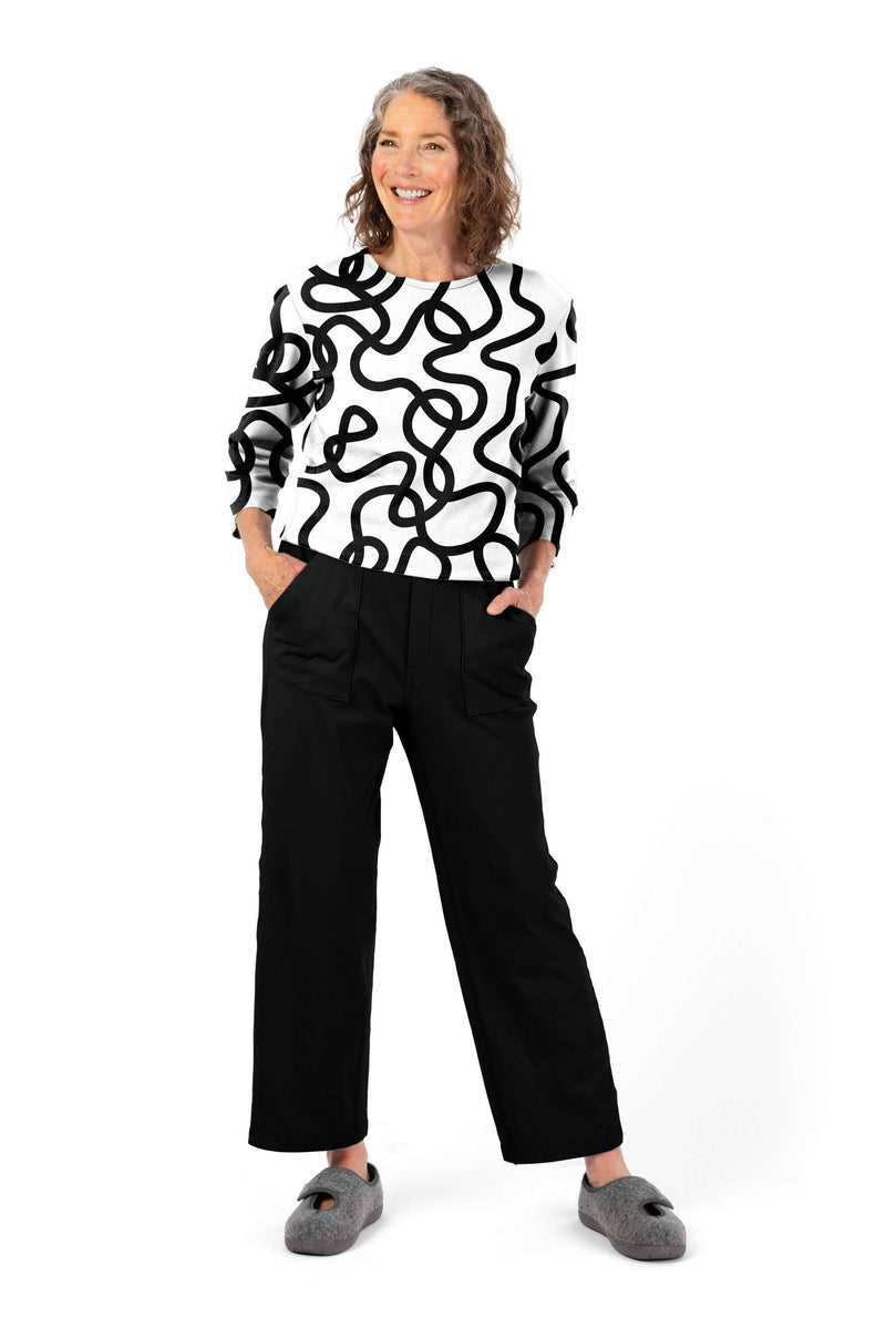 Women's Tunic Jumpsuit by Buck & Buck in White Top/Black Pants, and available in different sizes. This one-piece garments item is part of our one-pieces collection.