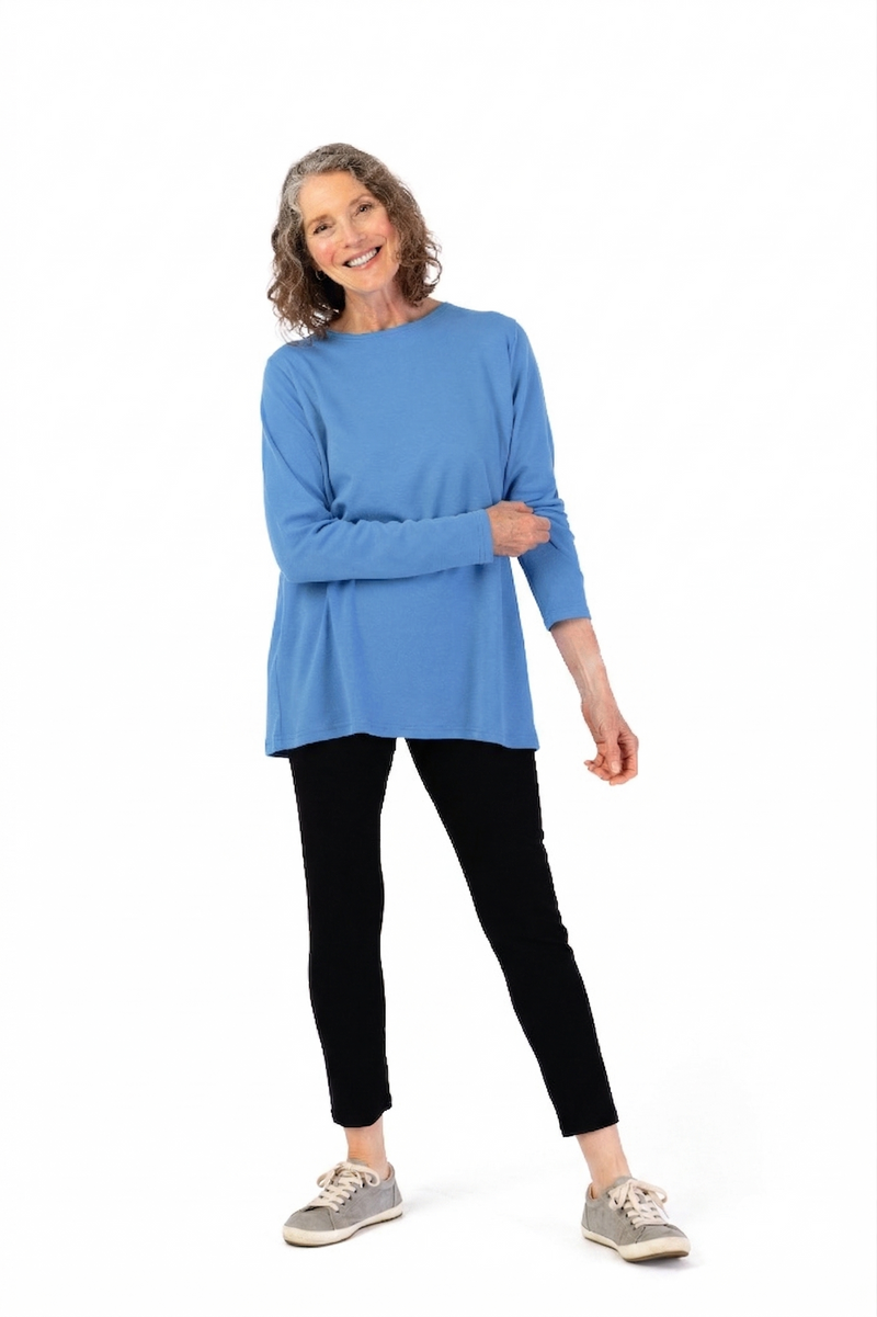 Women’s Long Sleeve Wrap Back T-Shirt + by Buck & Buck in medium blue, and available in different sizes. This shirt item is part of our tops collection.