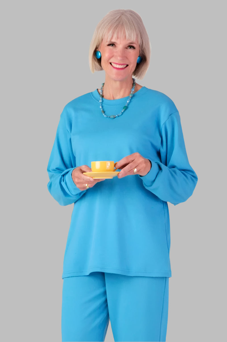 Women's Long Sleeve Solid Snap Back T-Shirt by Buck & Buck in Blue, and available in different sizes. This tops item is part of our t-shirts collection.