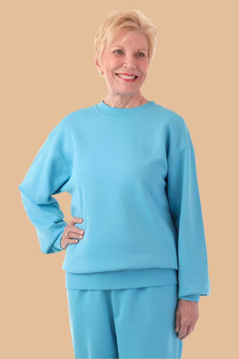 Women's Basic Wrap Back Sweat Top by Buck & Buck in Turquoise, and available in different sizes. This tops item is part of our sweatshirts collection.