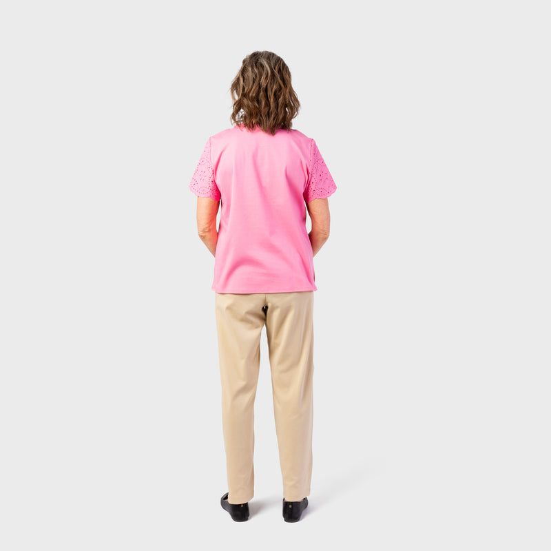 The back view of our Women's Short Sleeve Eyelet Top by Alfred Dunner in pink and available in different sizes. This top is part of our women's blouses  collection.