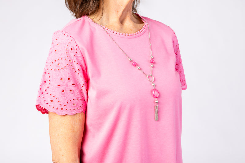 The Women's Short Sleeve Eyelet Top by Alfred Dunner in pink and available in different sizes. This top is part of our women's blouses  collection.