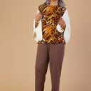 Poly Wrap Back Round Neck Blouse for women by Buck & Buck, and available in different sizes. This tops item is part of our blouses collection.