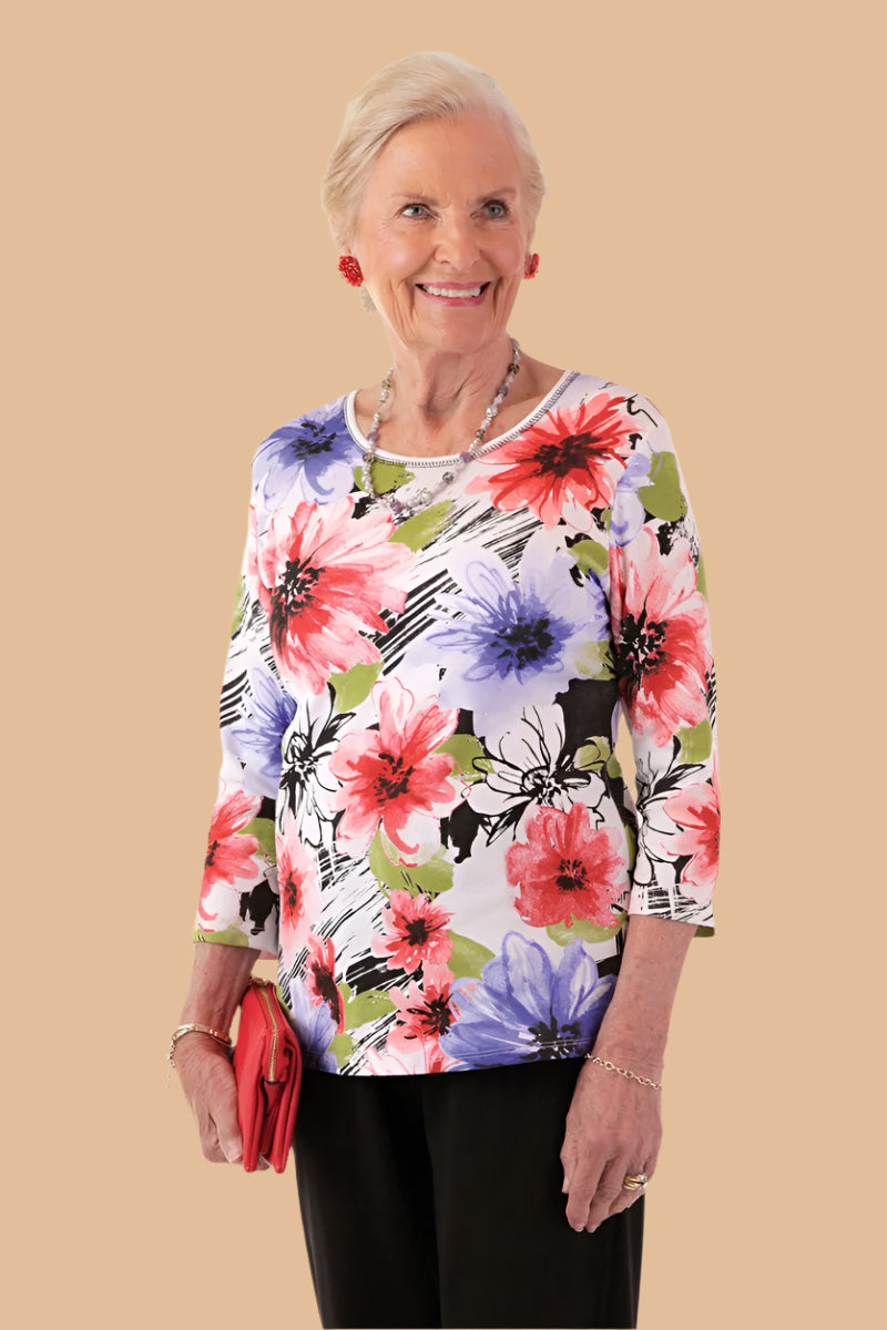 Snap Back Block Printed Knit Top for women by Buck & Buck in Black, and available in different sizes. This tops item is part of our blouses collection.