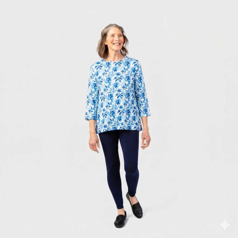 Women's Wrap Back Tunic by Buck & Buck in blue watercolor flowers, and available in different sizes. This wrap back item is part of our tops collection.