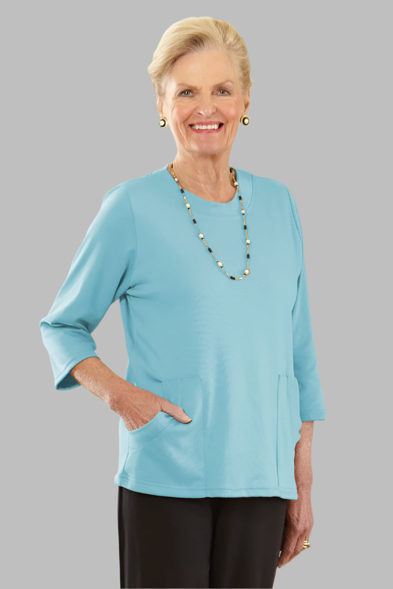 Solid Knit Top With Pockets for women by Buck & Buck in Turquoise, and available in different sizes. This tops item is part of our blouses collection.
