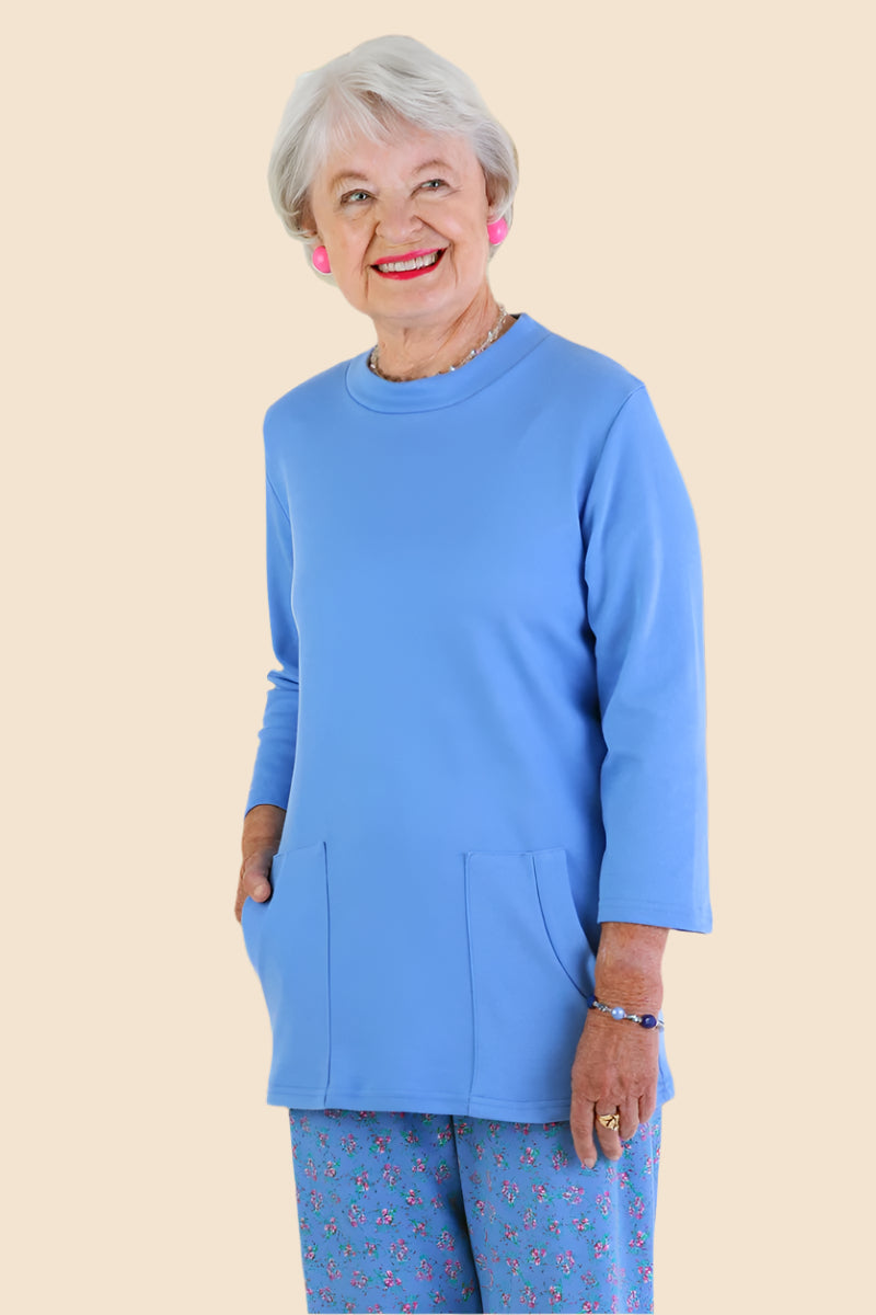 Solid Moon Pocket Wrap Back Top for women by Buck & Buck in Turquoise, and available in different sizes. This tops item is part of our blouses collection.