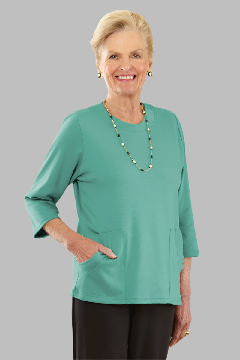 Solid Moon Pocket Wrap Back Top for women by Buck & Buck, and available in different sizes. This tops item is part of our blouses collection.