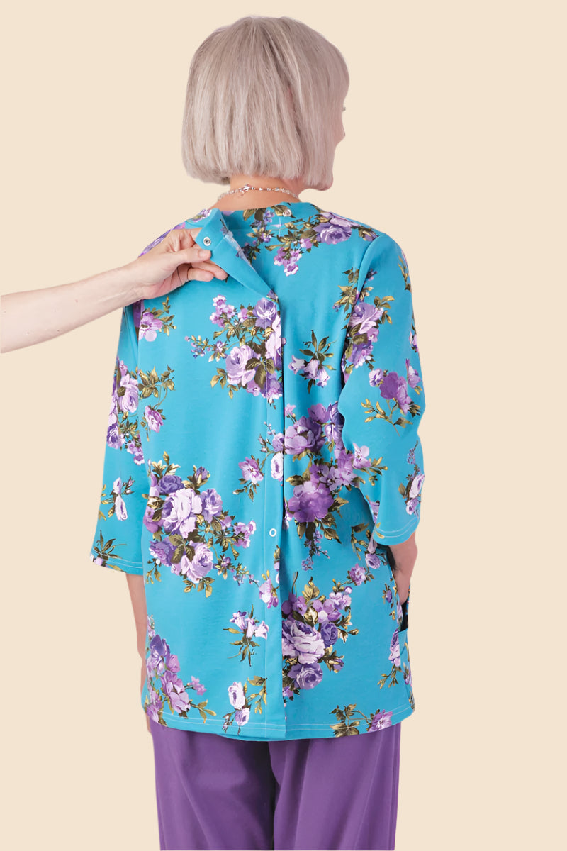 Printed Moon Pocket Wrap Back Top for women by Buck & Buck in Turquoise, and available in different sizes. This tops item is part of our blouses collection.