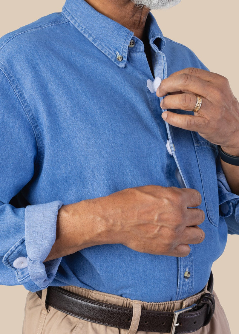 Men's Long Sleeve Denim Shirt With VELCRO® Fasteners by Buck & Buck in Denim, and available in different sizes. This tops item is part of our shirts collection.