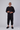 Men's Knicker Back-Zip Sleep Suit by Buck & Buck in black, and available in different sizes. This one-piece garments item is part of our sleepwear & loungewear collection.