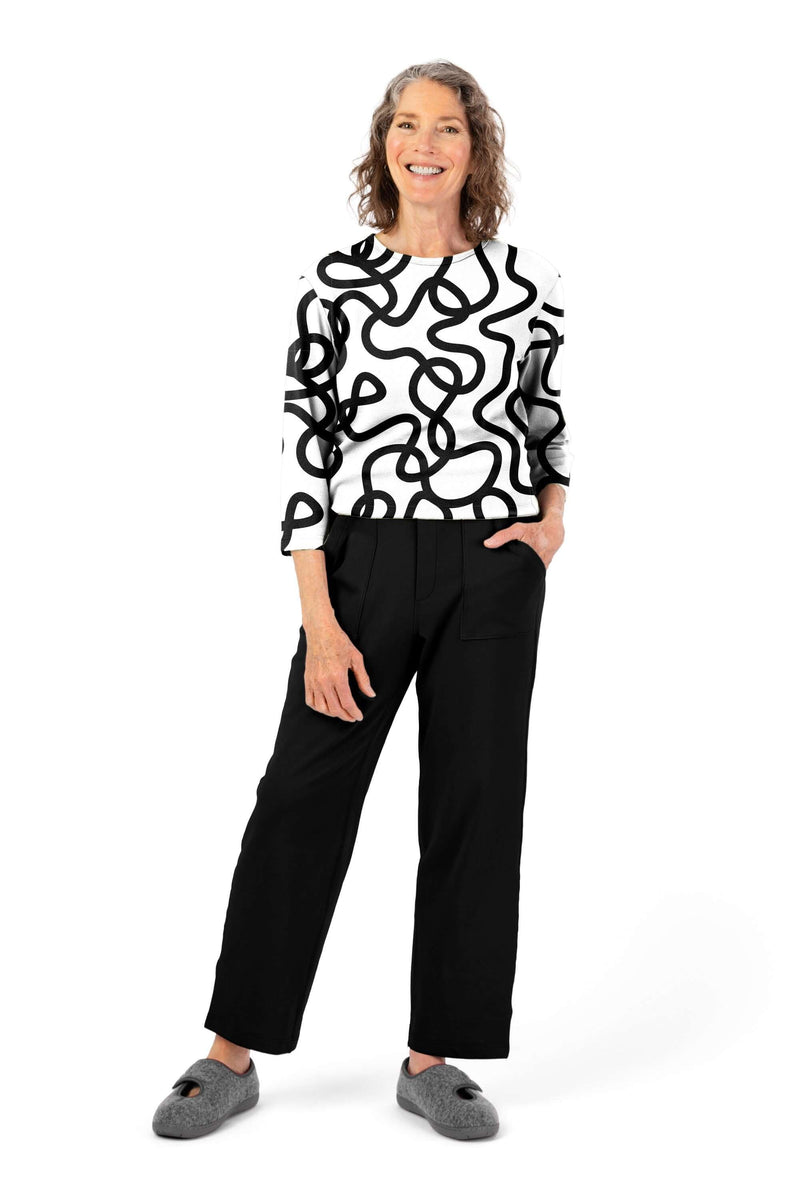 Women's Tunic Jumpsuit by Buck & Buck in White Top/Black Pants, and available in different sizes. This one-piece garments item is part of our one-pieces collection.