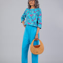 Printed Top Perfect Fit Jumpsuit for women by Buck & Buck in turquoise, and available in different sizes. This one-piece garments item is part of our one-pieces collection.