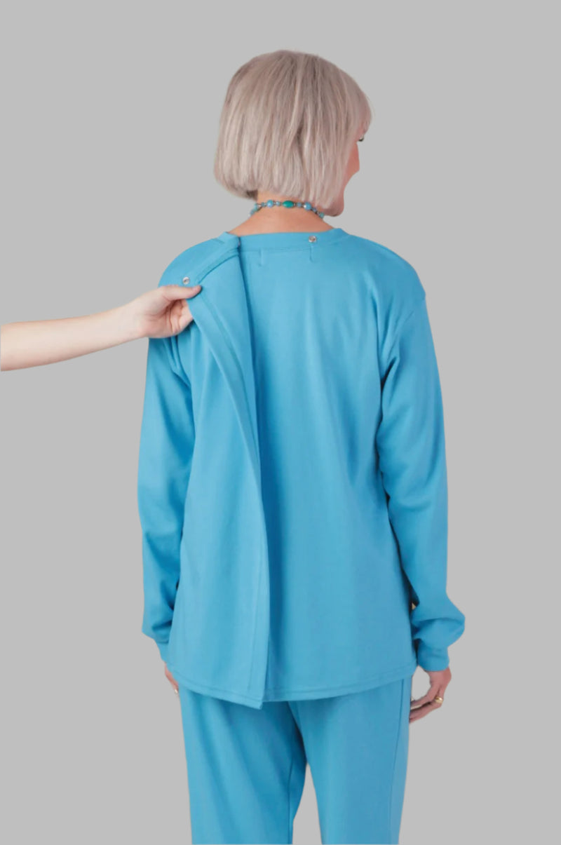 Women's Long Sleeve Wrap Back T-Shirt by Buck & Buck in Turquoise, and available in different sizes. This tops item is part of our t-shirts collection.