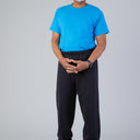 Men's Short Sleeve Basic T-Top Jumpsuit by Buck & Buck in turquoise Top/black Pants, and available in different sizes. This one-piece garments item is part of our one-pieces collection.