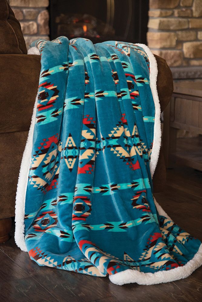Turquoise Southwest Plush Throw by Buck & Buck, and available only in a one-size option. This accessories & home item is part of our blankets collection.